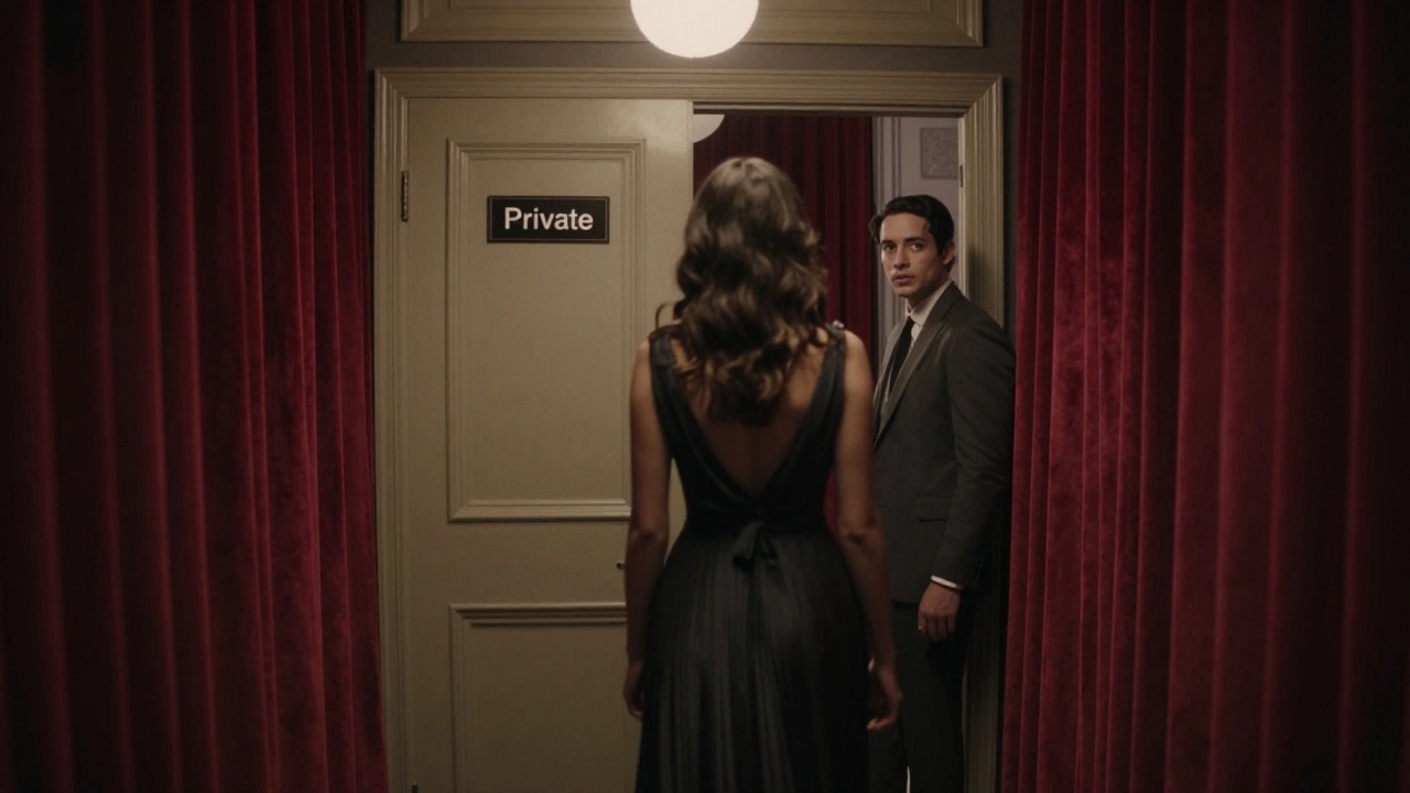 A young woman walks away from a private door in the Palais des Festivals, shadowed and silent.